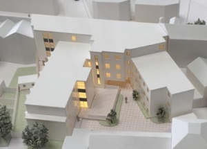 White architectural model main site building with integrated lighting.