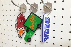 Three laser cut keyrings make from laser cut and engraved acrylic.