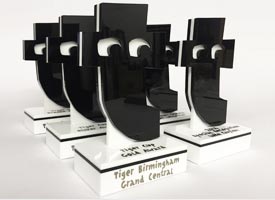 Employee awards for Tiger made from white and black laser cut acrylic.