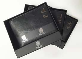 Leather engraving on wallets with buiness logo.