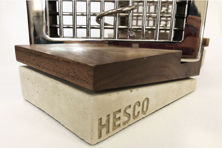 Close up of concrete and walnut trophy bases for Hesco