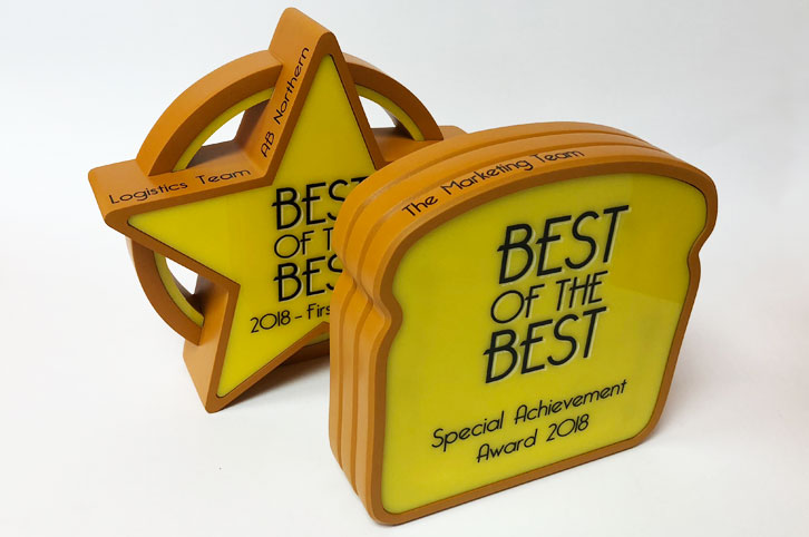 Personalised bespoke trophies for Allied Bakery, made using CNC milling.