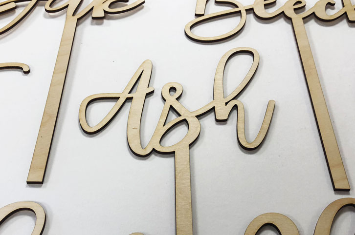 Laser cut plywood table names for wedding tables.