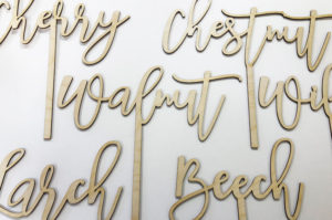 Laser cut plywood table names for wedding tables.