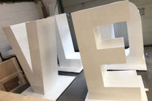 Large 3d cnc cut letters, painted white.