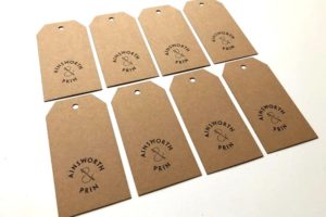 Laser cut hand stamped tags on recycled card