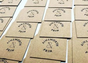 Laser cut hand stamped tags on recycled card