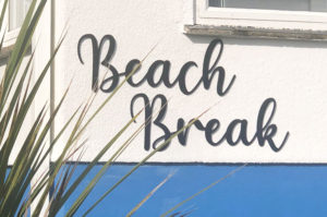 CNC machined acrylic lettering for beach house signage