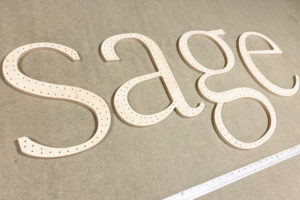 CNC cut large letters cut from 9mm birch plywood.