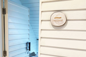 Engraved, natural birch wood slice used as a room name in Bamfords Wellness Spa.