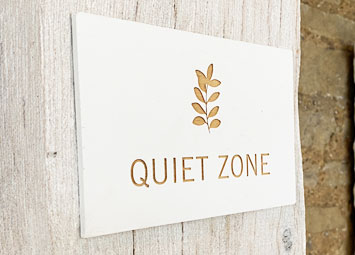 Painted white wood sign, laser engraved with information..