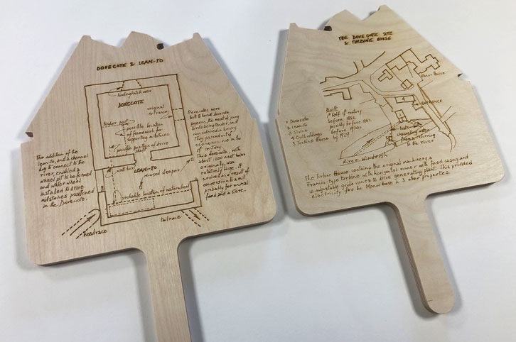 CNC machined wood signs with laser engraved information. Showing front and back engraving.
