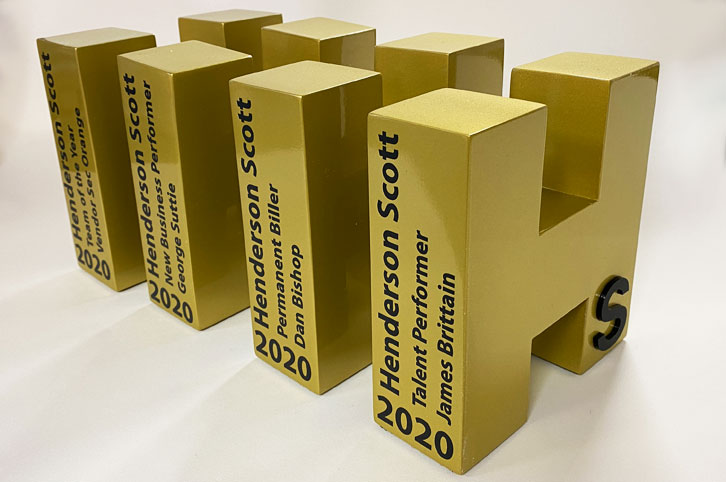 Bespoke metalic gold large letter awards for Henderson Scott.