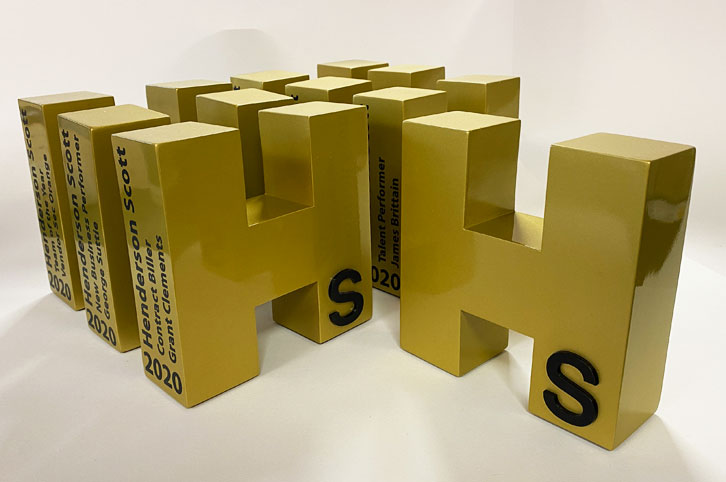 Bespoke metalic gold large letter awards for Henderson Scott.