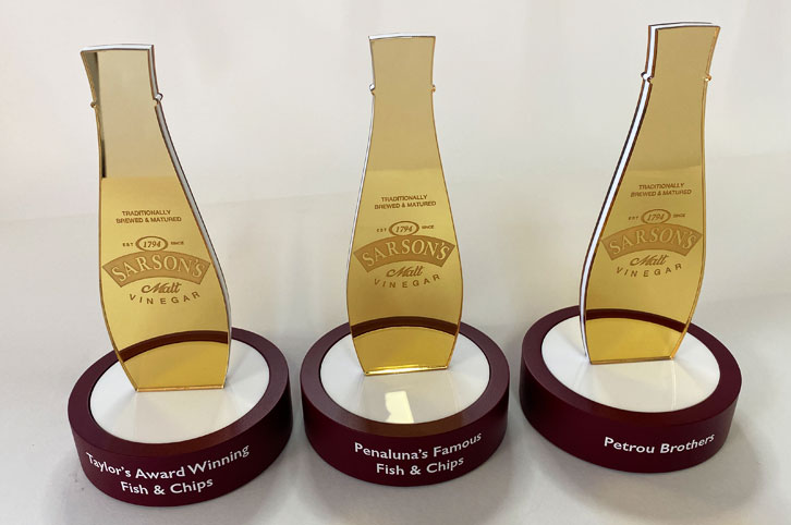 Bespoke laser cut Sarsons malt vinegar trophies given out to fish and chip shops