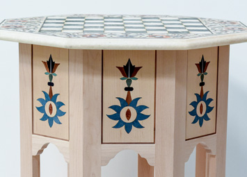 SIde table with laser cut wood veneers design.