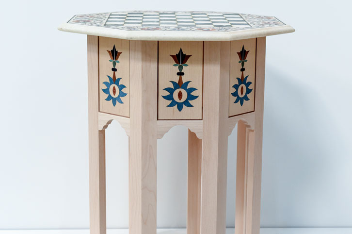 SIde table with laser cut wood veneers design.