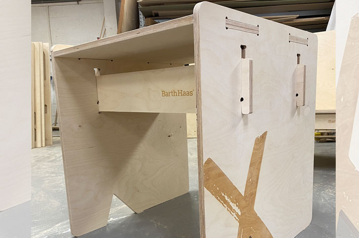 Slot together furniture, cnc machined from birch plywood with a laser engraved logo.
