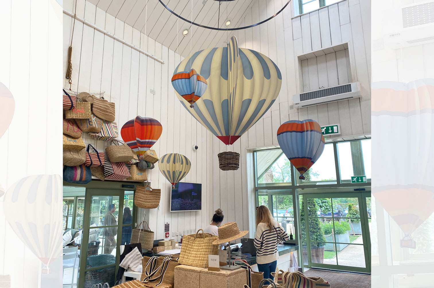 Shop display of wood slot together hanging hot air balloons for Daylesford Farm.