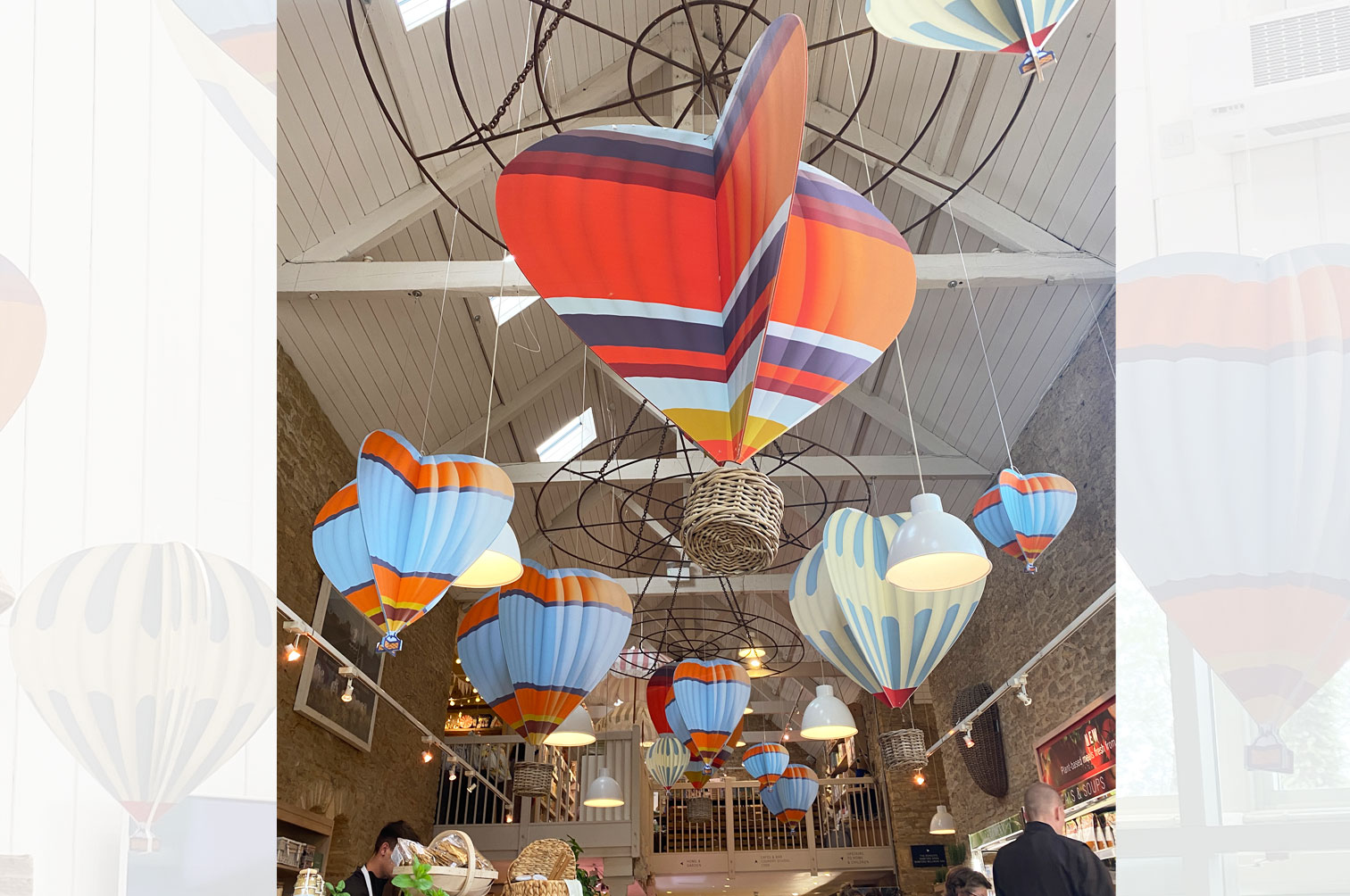 Shop display of wood slot together hanging hot air balloons for Daylesford Farm.