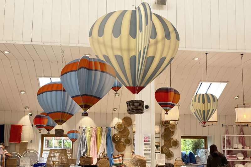 Shop display for Daylesford, hanging wooden balloon props.