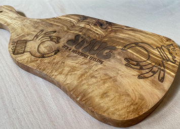 Laser engraved wood chopping board engraving.