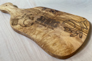 Laser engraved wood chopping board engraving.