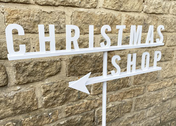 Christmas directional signage, painted wood signs.