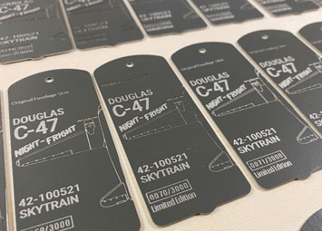Engraved C-47 aviation tags.