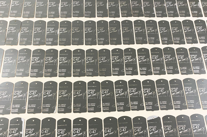 Engraved C-47 aviation tags.